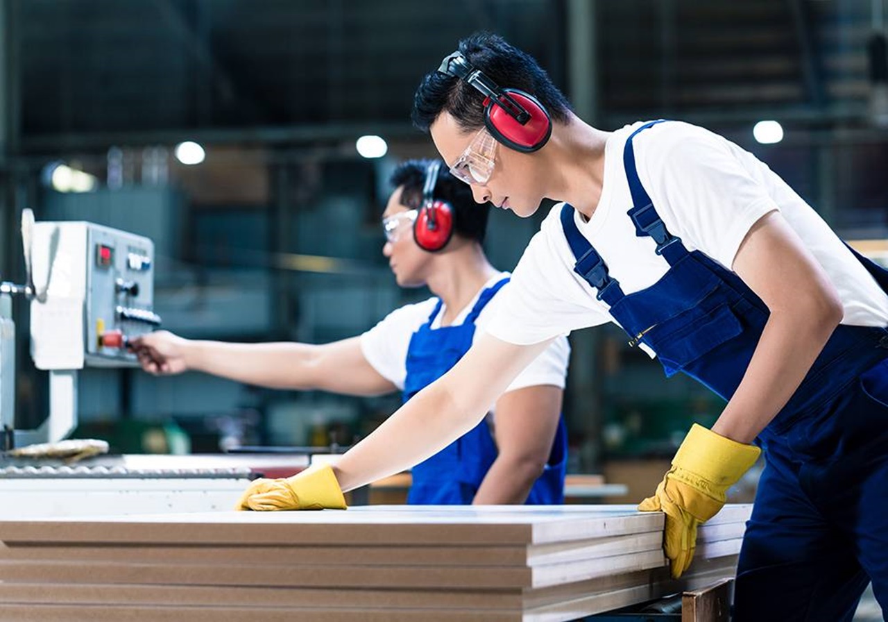 worker with wood boards